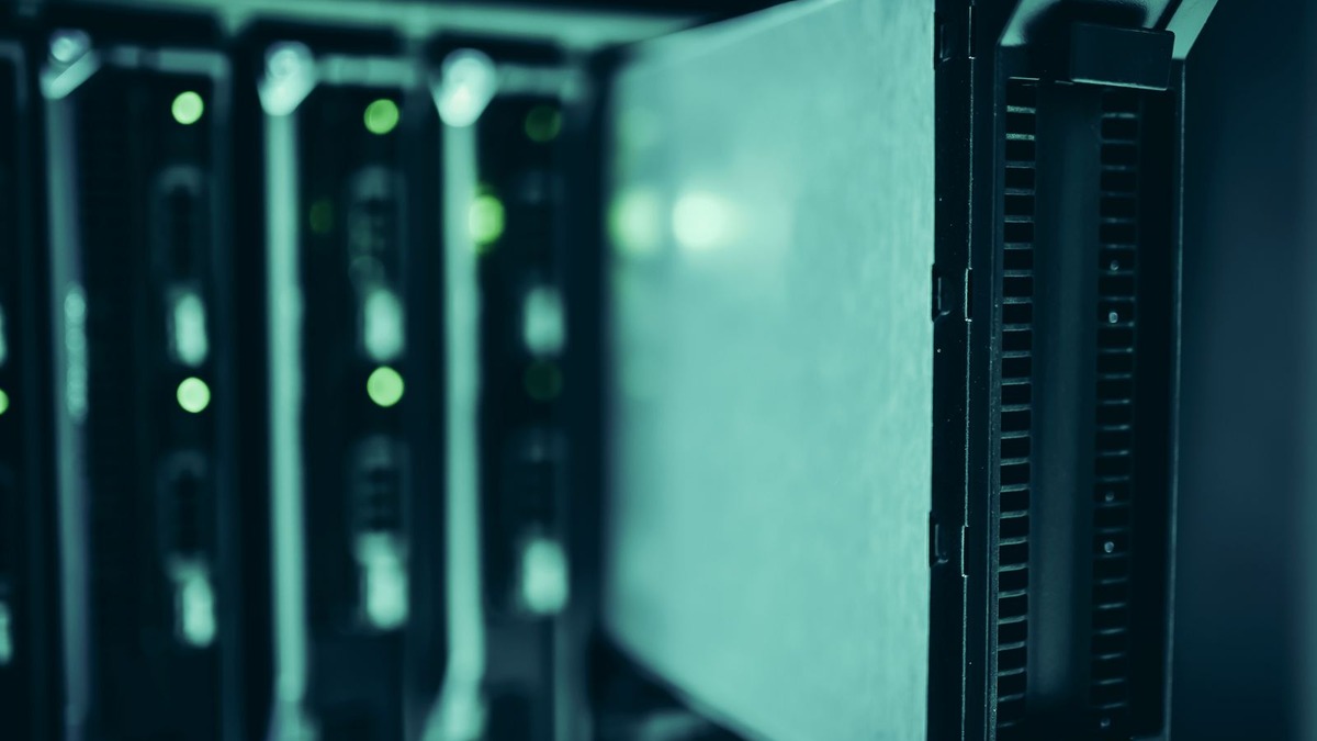 Server racks in a data center running self-hosted AI inference