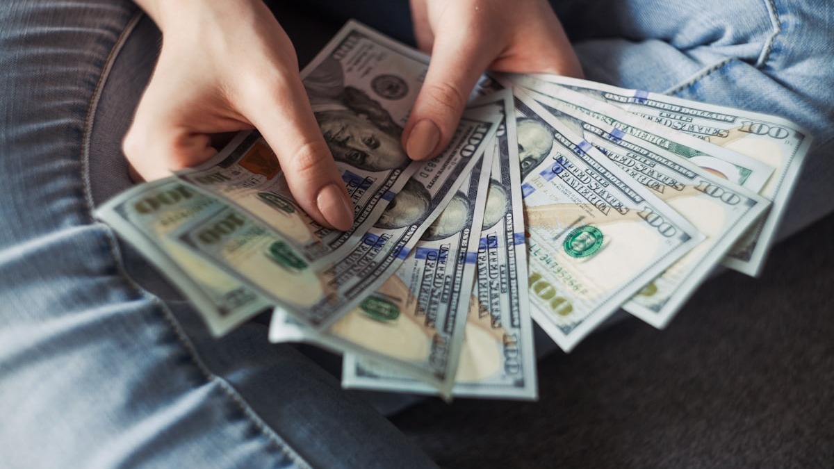 Coins and a piggy bank representing passive income from digital products