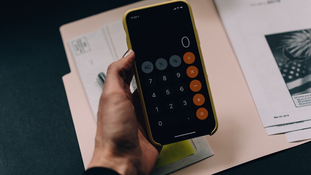 Budget planning with calculator and financial documents on a desk