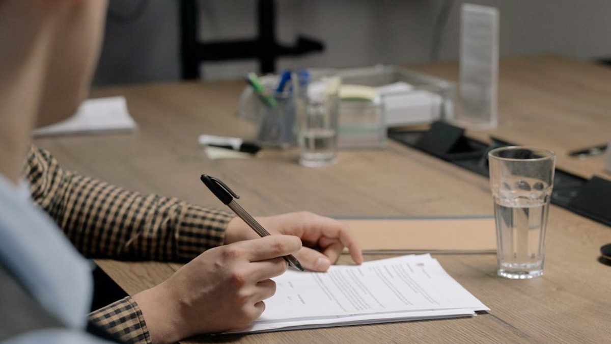 A person signing a contract document
