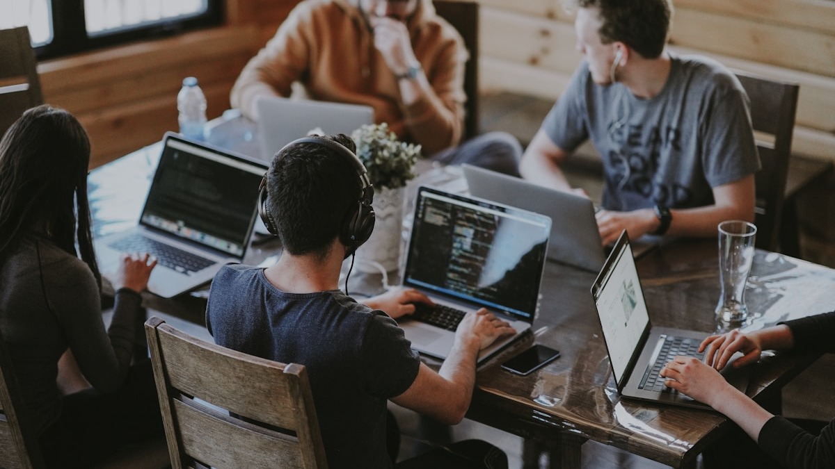 Team of developers reviewing code together on a shared screen