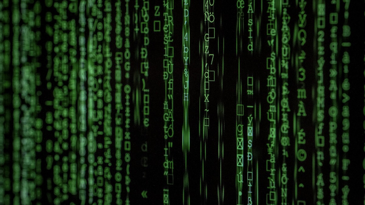A green matrix-style cascade of code characters on a dark screen