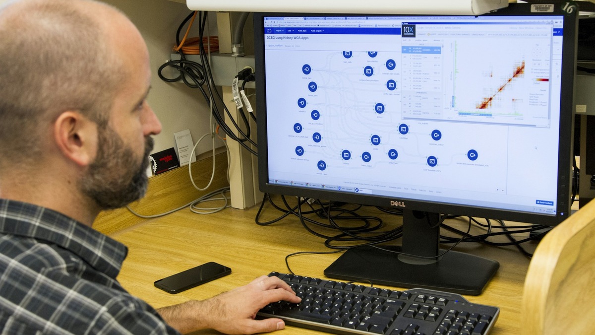 A scientist at a computer analysing genomic data, the kind of workflow GPT-Rosalind targets