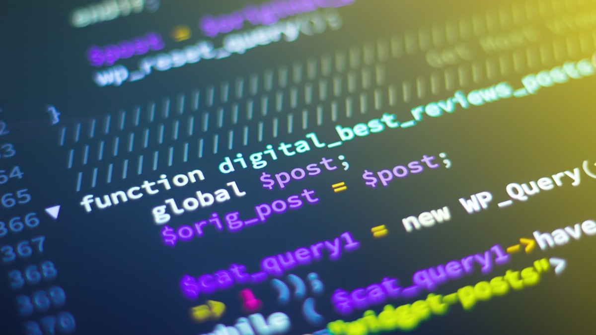 Code on a dark terminal screen showing software development workflow