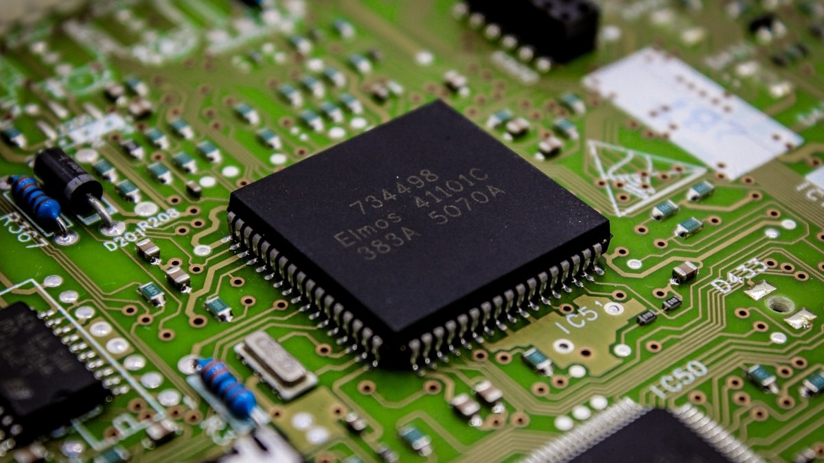 Circuit board close-up illustrating the multi-expert routing in MoE models