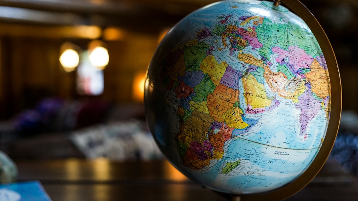 A world globe on a desk, showing Europe, Africa, and Asia