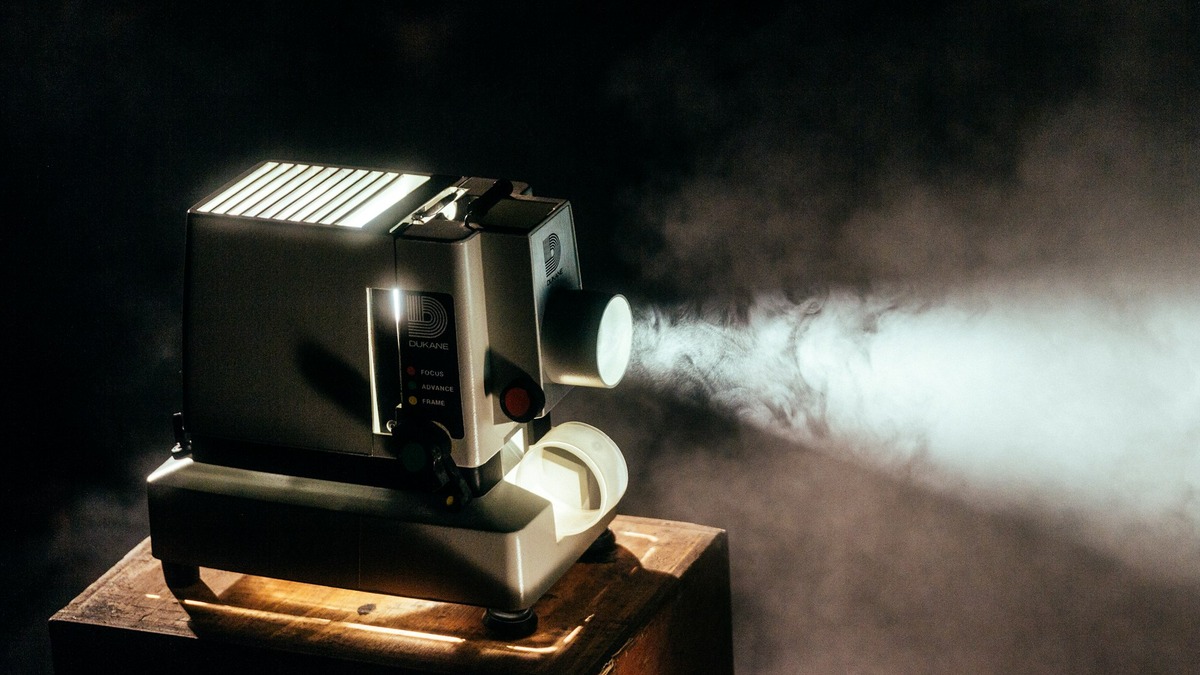 Cinema projector in a dark room, symbolizing video generation technology