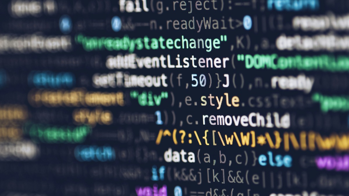 A monitor displaying code lines in a development environment