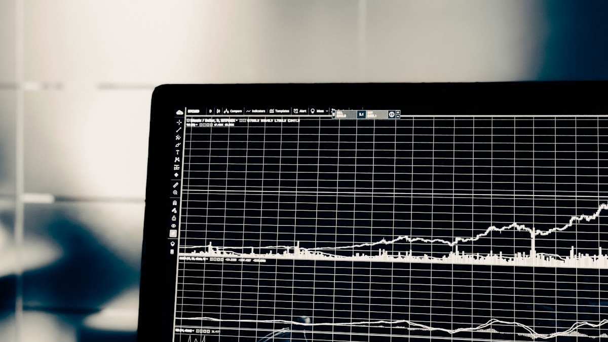 A financial spreadsheet open on a laptop in an office setting