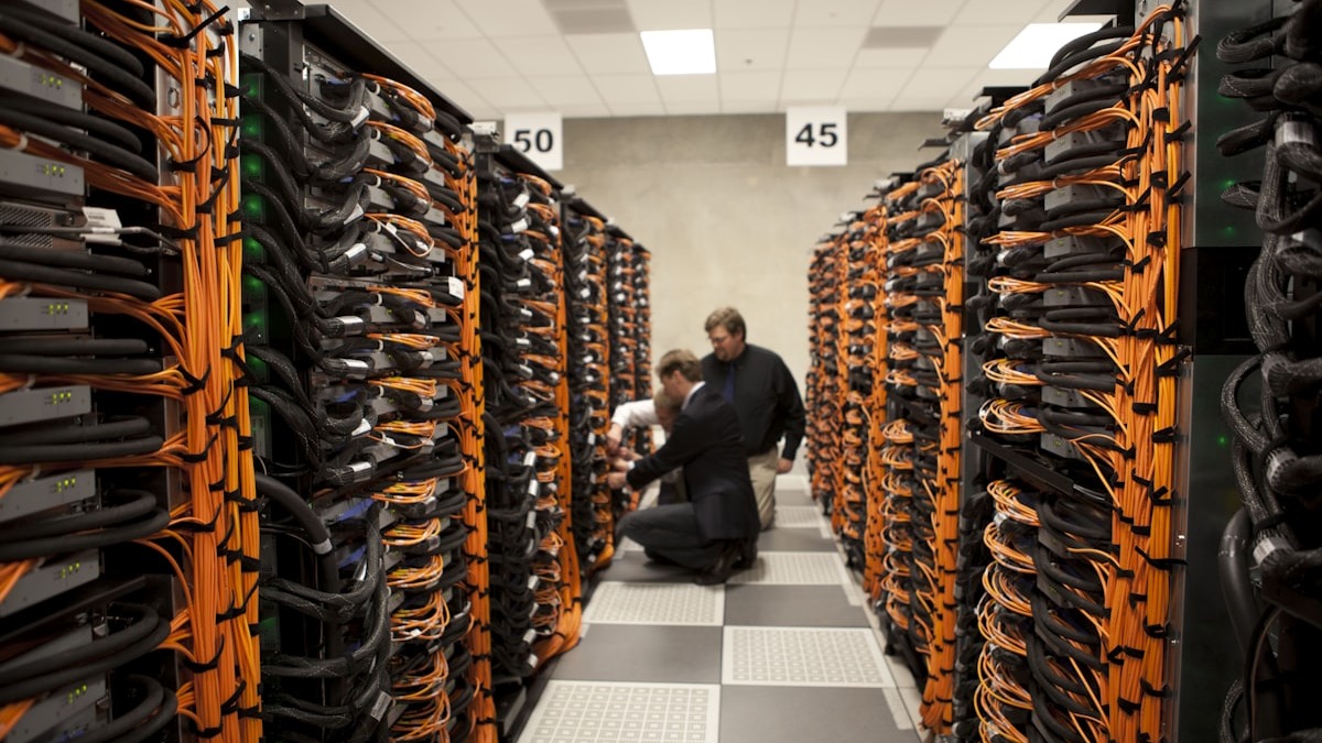 Rows of servers inside a large data center facility