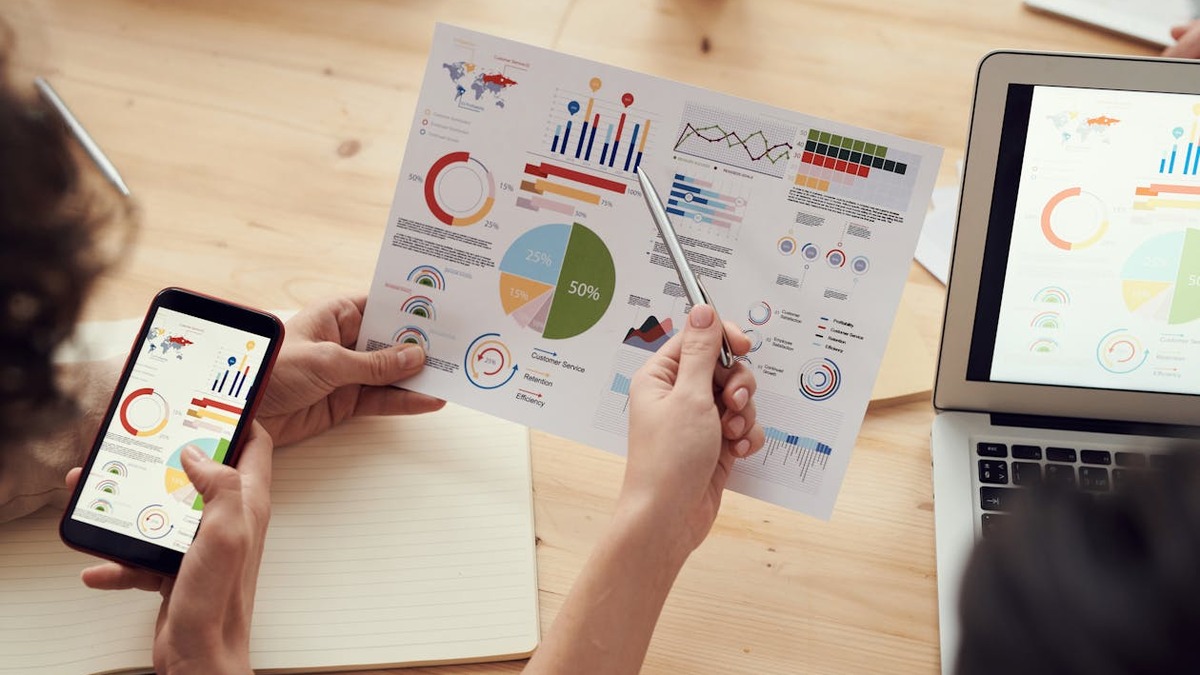 Team working on laptops in a modern office environment