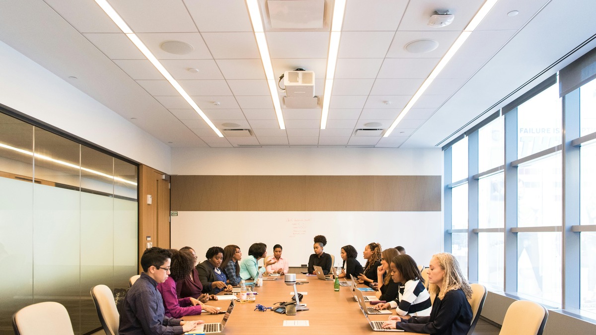 Enterprise professionals collaborating in a modern boardroom