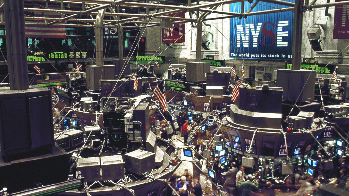 The New York Stock Exchange trading floor with flags and ticker displays