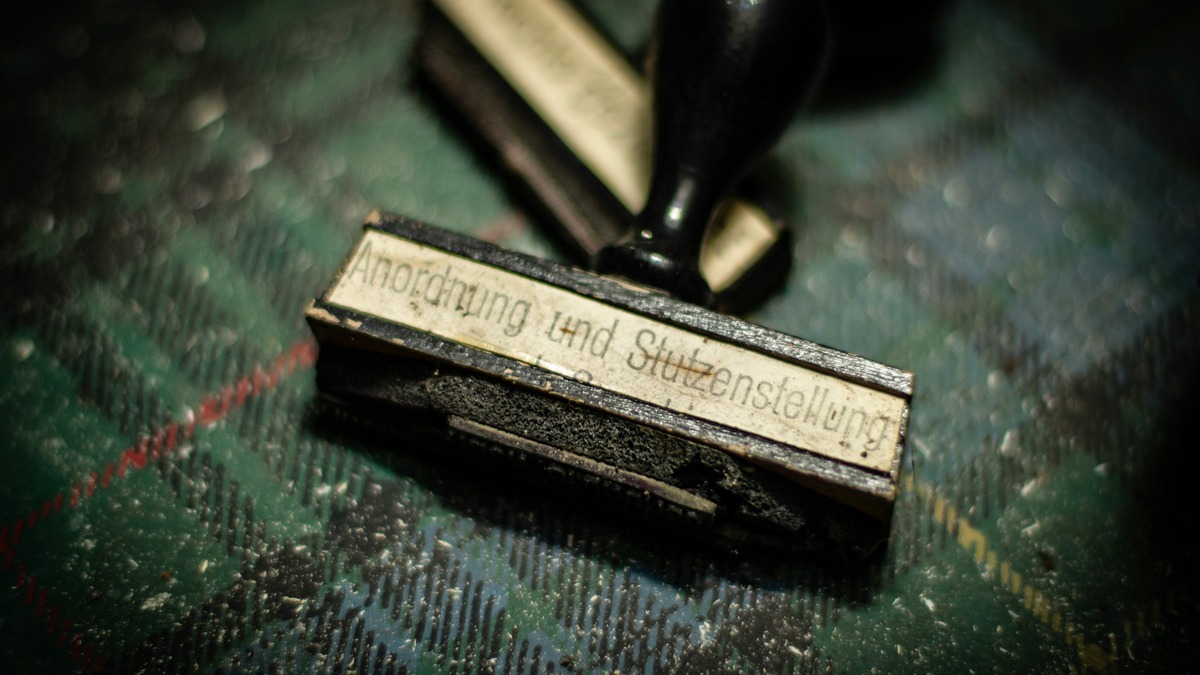 An official rubber stamp on a document, representing government clearance