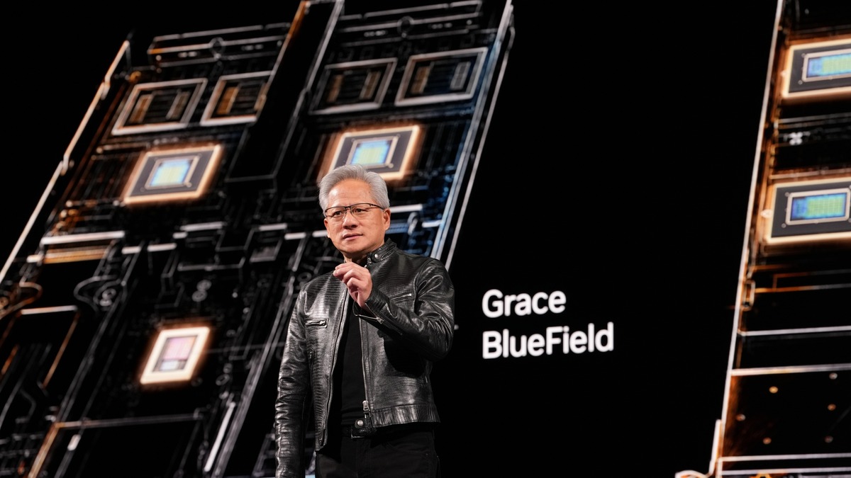 NVIDIA CEO Jensen Huang speaking on stage with Grace BlueField chip signage behind him