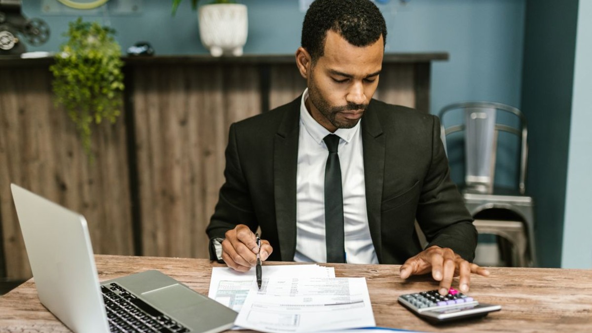 Regulatory compliance documents and legal paperwork on a desk