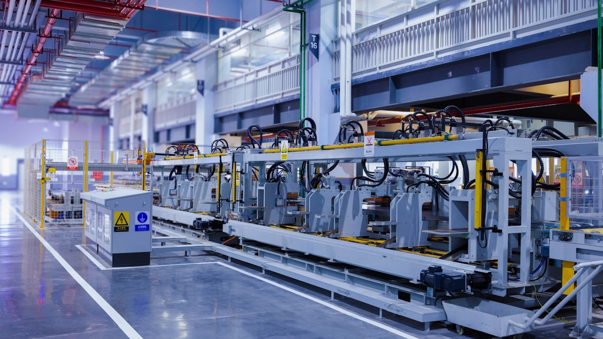 Automated manufacturing assembly line with robotic machinery in a modern industrial facility