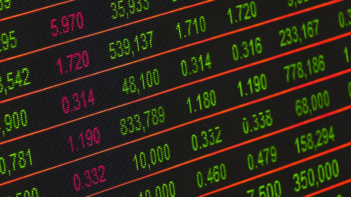 Stock market ticker showing red and green price data