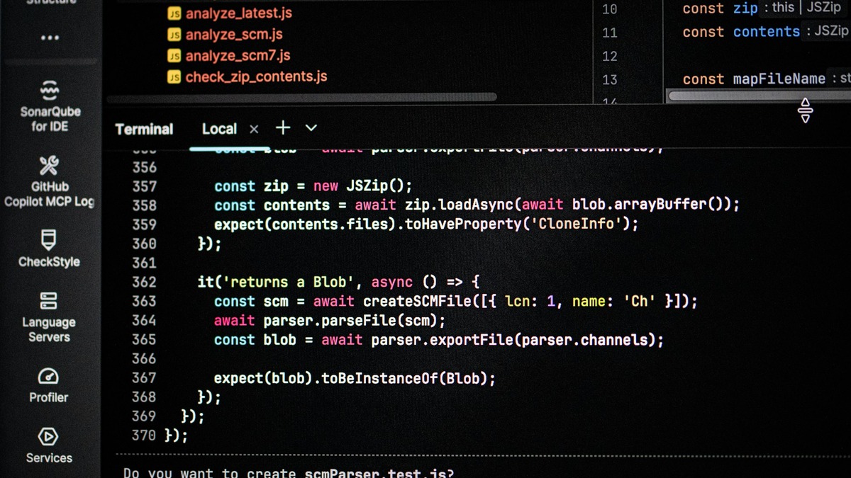 Close-up of a computer screen displaying lines of code and terminal output