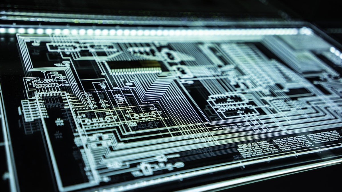 Circuit board close-up representing the complexity of software systems and security research