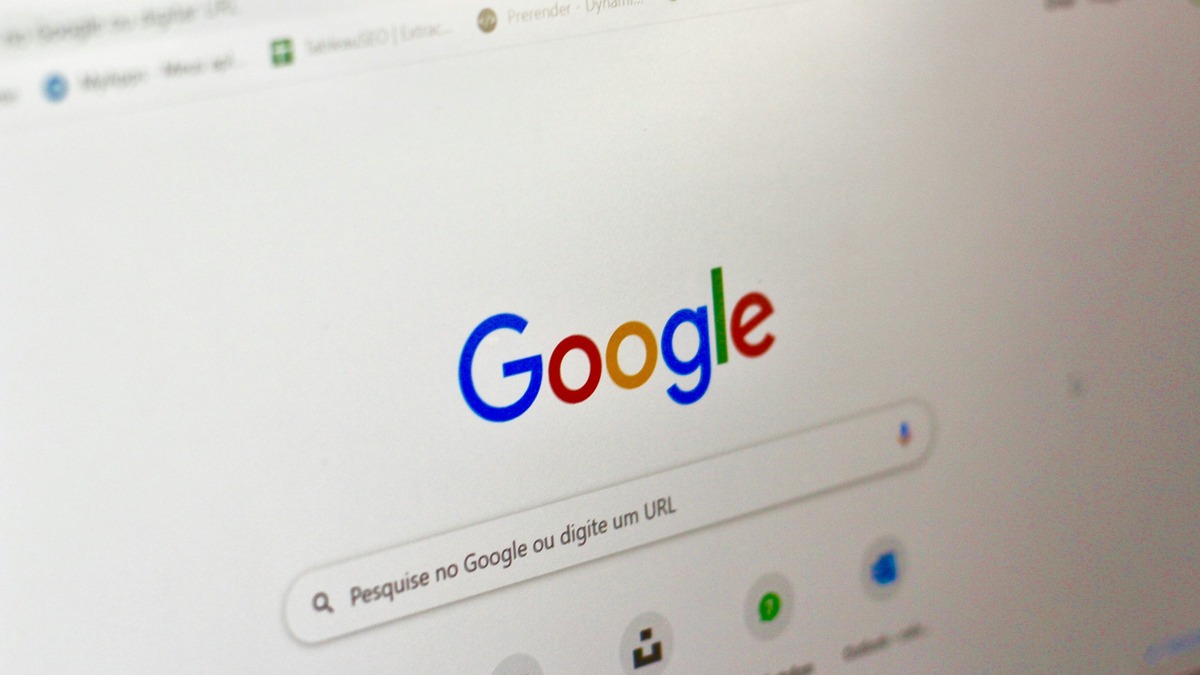 A magnified Google homepage displayed on a laptop screen