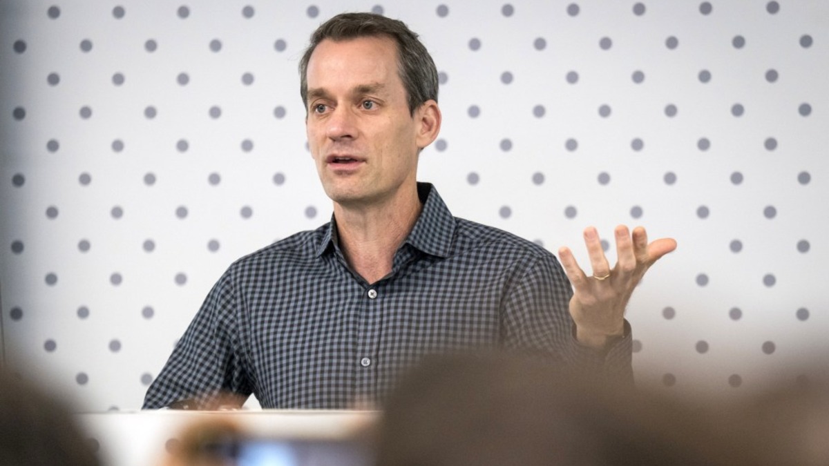 A tech executive speaking at a conference panel