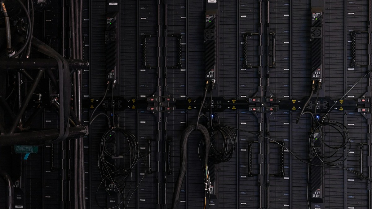 Dark server rack in a dimly lit data centre