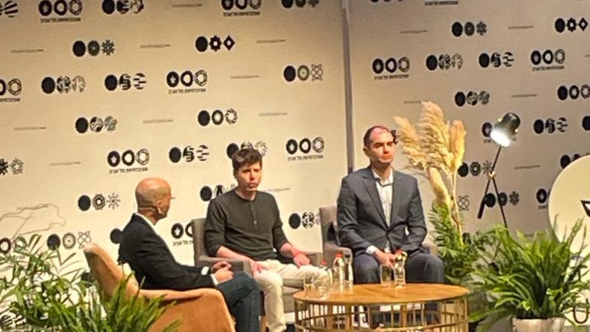 Ilya Sutskever and Sam Altman standing together at a public event