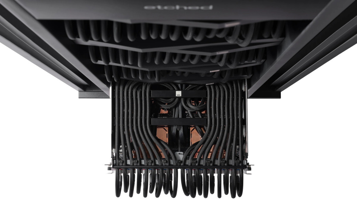 The interior of Etched's server, showing the liquid cooling and cable management co-designed with the Sohu chip