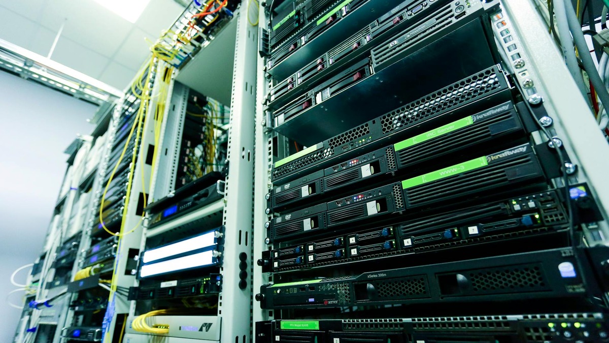 Server racks in a data center - the kind of infrastructure Zhipu scaled to 100,000 Huawei Ascend chips