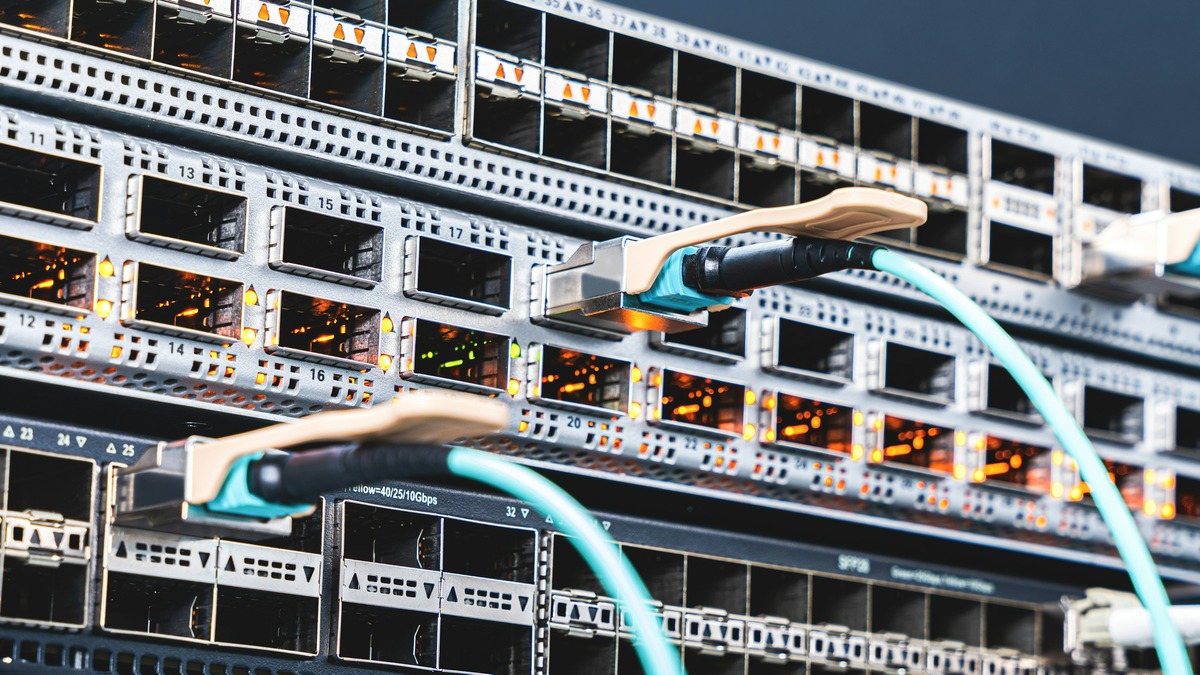 Dense rows of server racks inside a modern data center