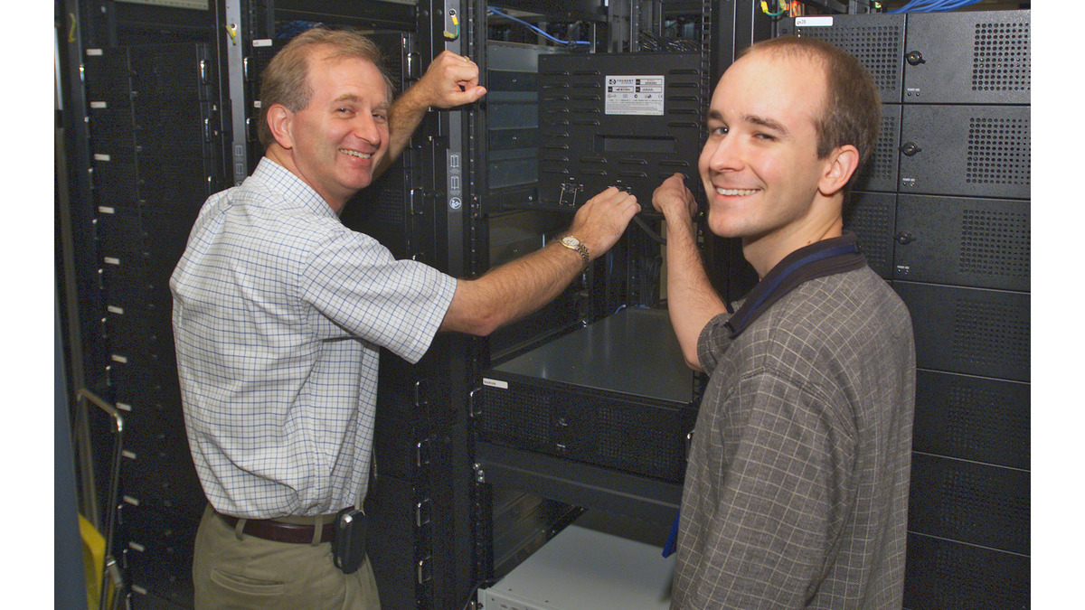 Rows of server racks in a large data center