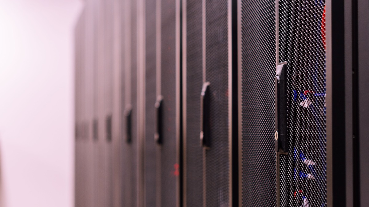 A row of enterprise server racks in a data center corridor