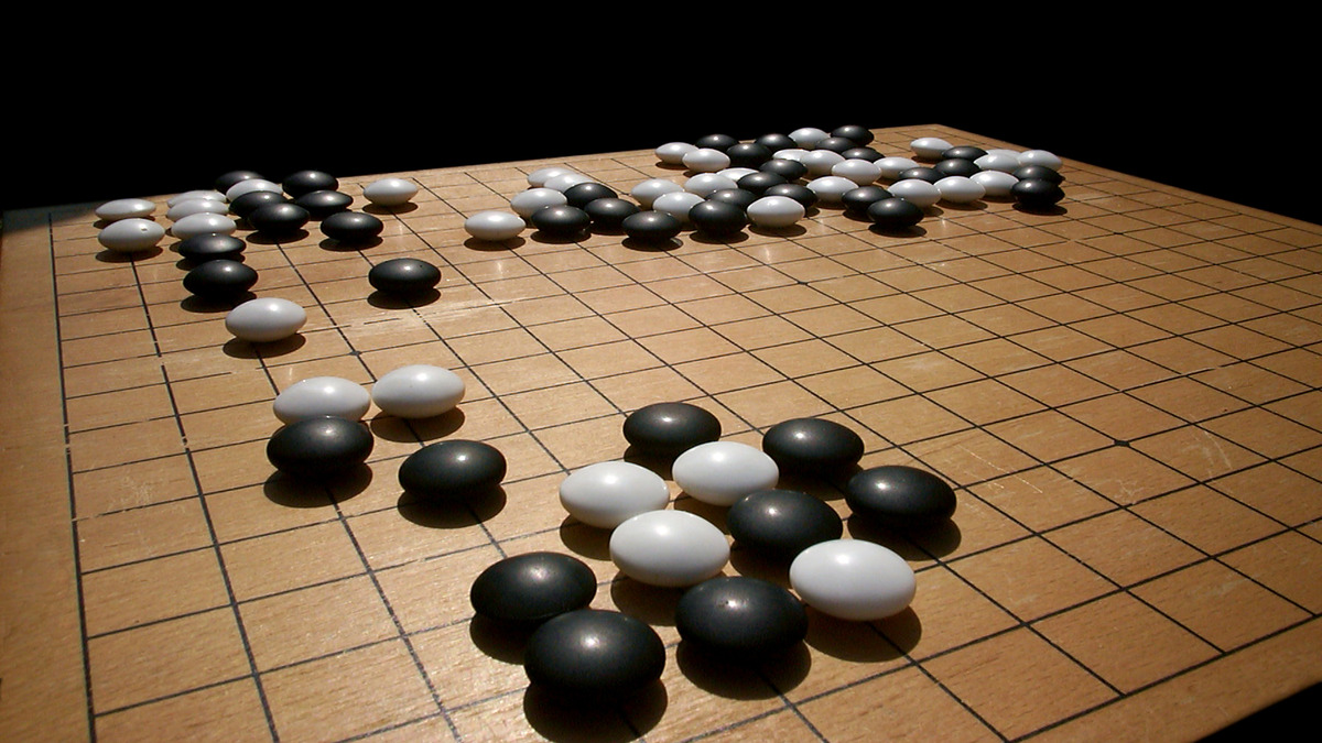 A Go board with black and white stones