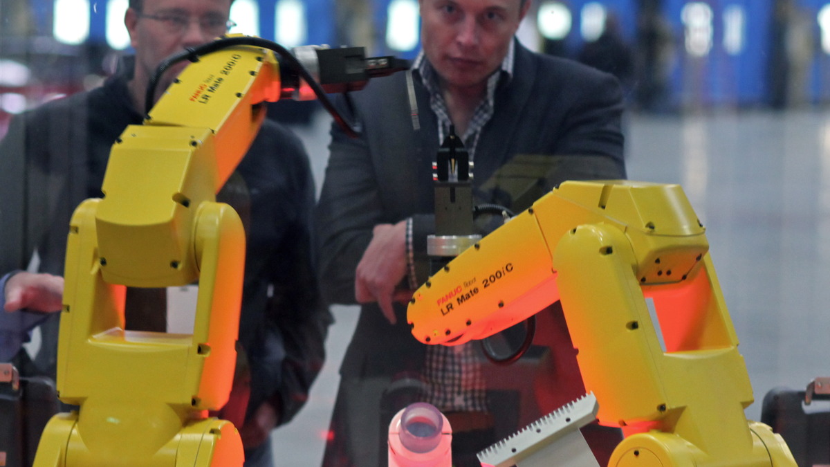 A FANUC industrial robot performing an assembly task - the kind of physical AI application Japan's new venture targets