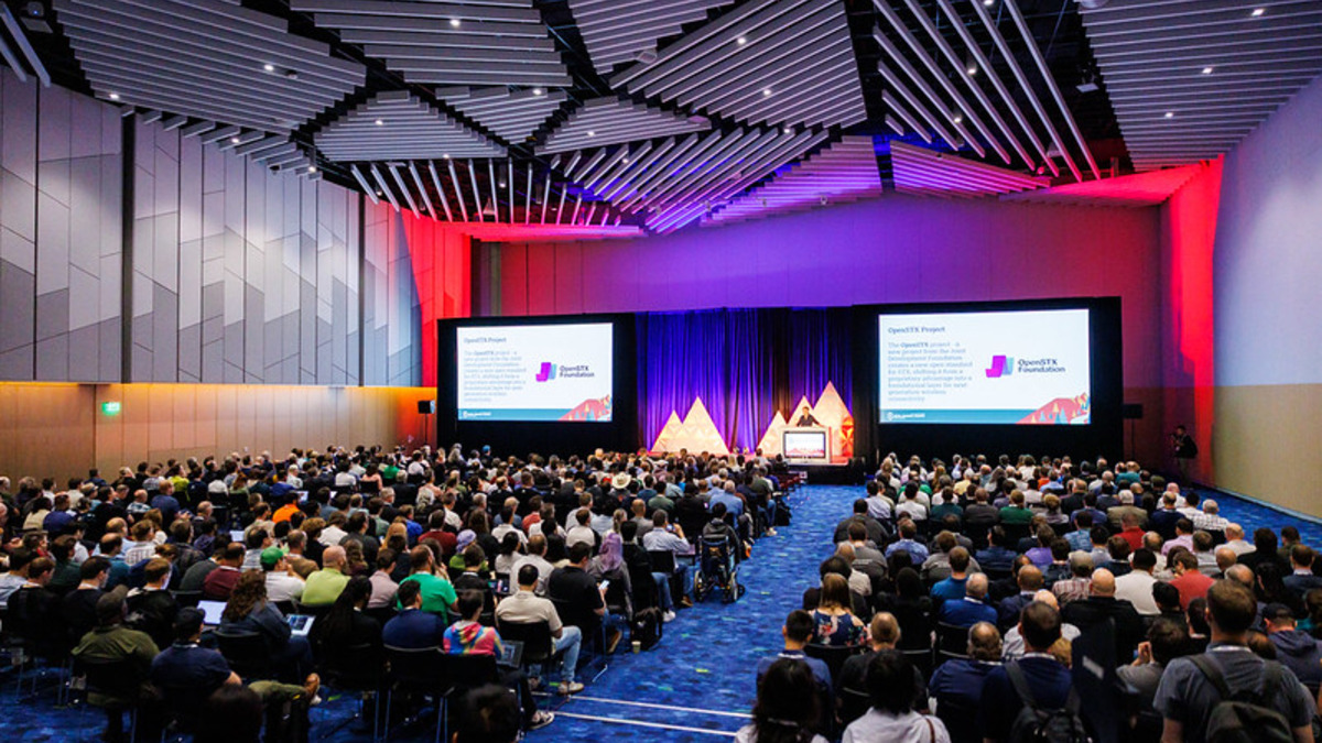 Maintainers discussing code security at a conference