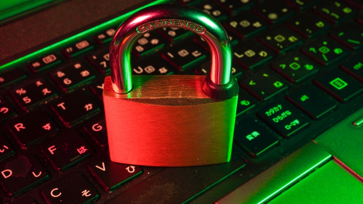 Padlock on a laptop keyboard - a visual metaphor for digital security and privacy risk