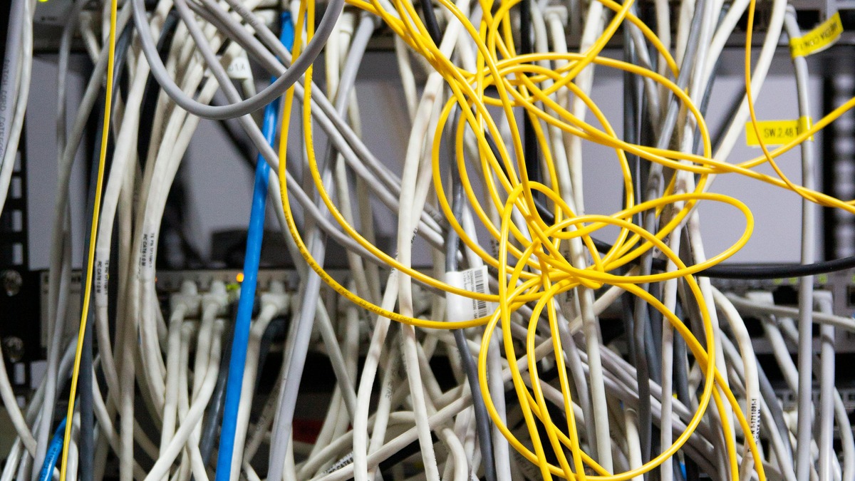 Network cables in a server, showing the physical infrastructure where LLM routing happens