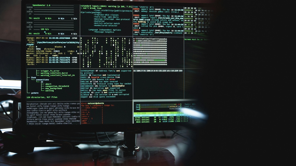 A terminal screen showing lines of code in a dark room
