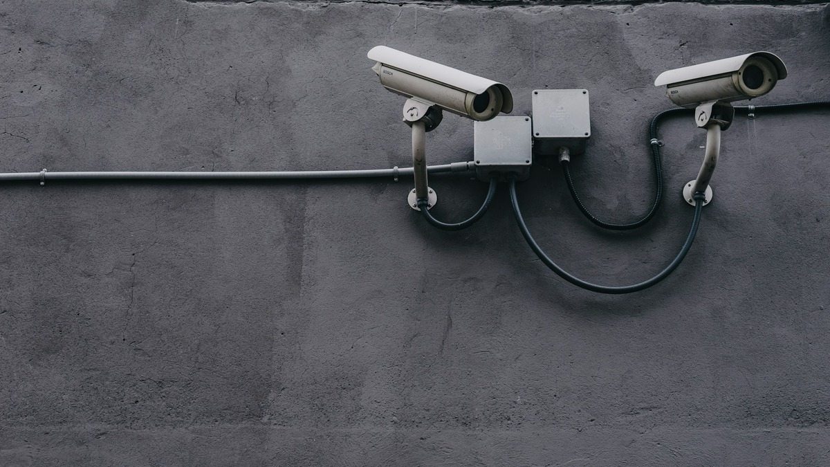 A surveillance camera mounted outside an office building