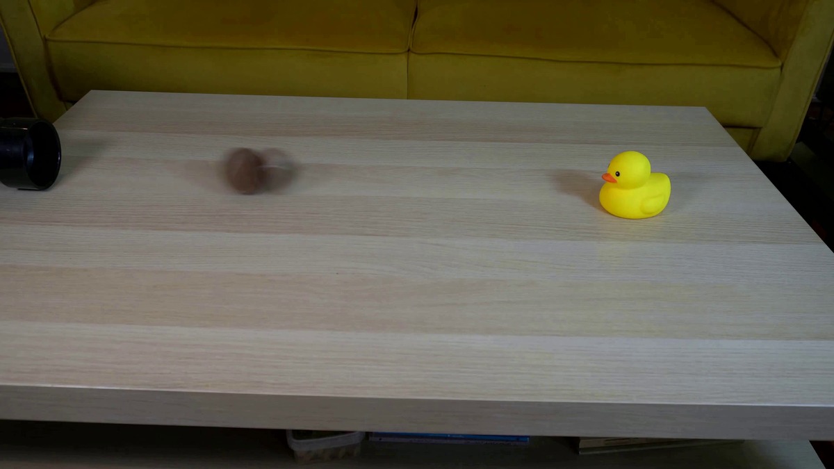 A second sample frame from the Netflix VOID repo showing a bouncing ball physics scene