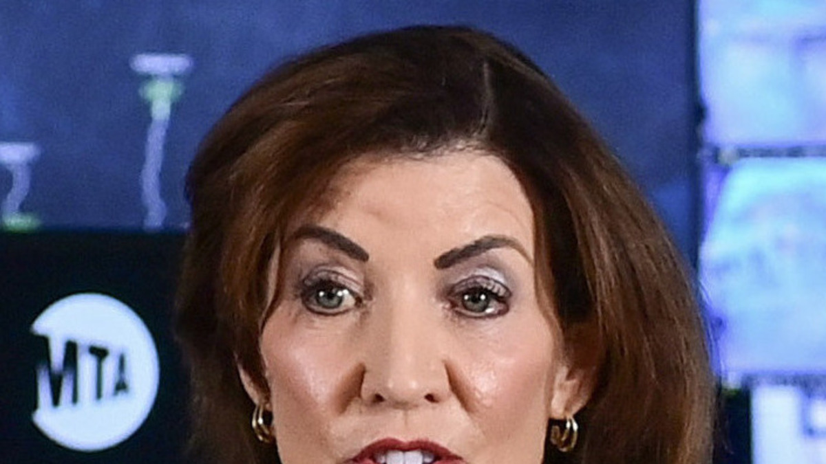 New York Governor Kathy Hochul speaking at a podium bearing the state seal