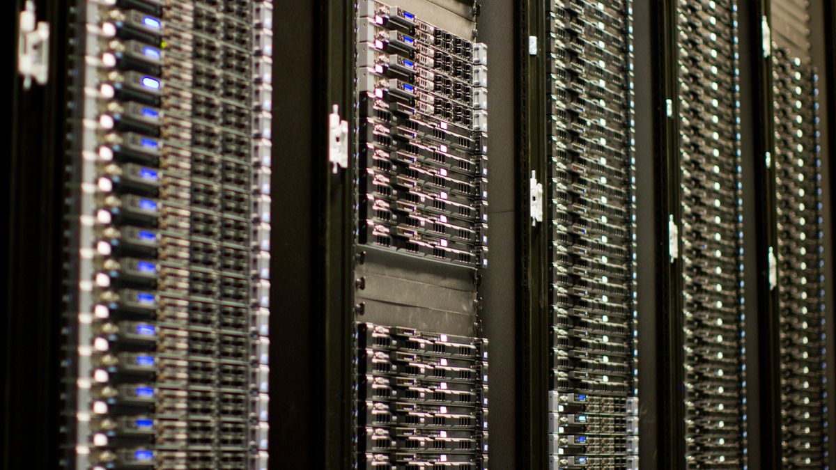 Dense production server rack with cable management and status indicator LEDs