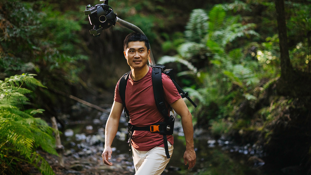 Odyssey co-founder Oliver Cameron wearing the company's data collection backpack in the field