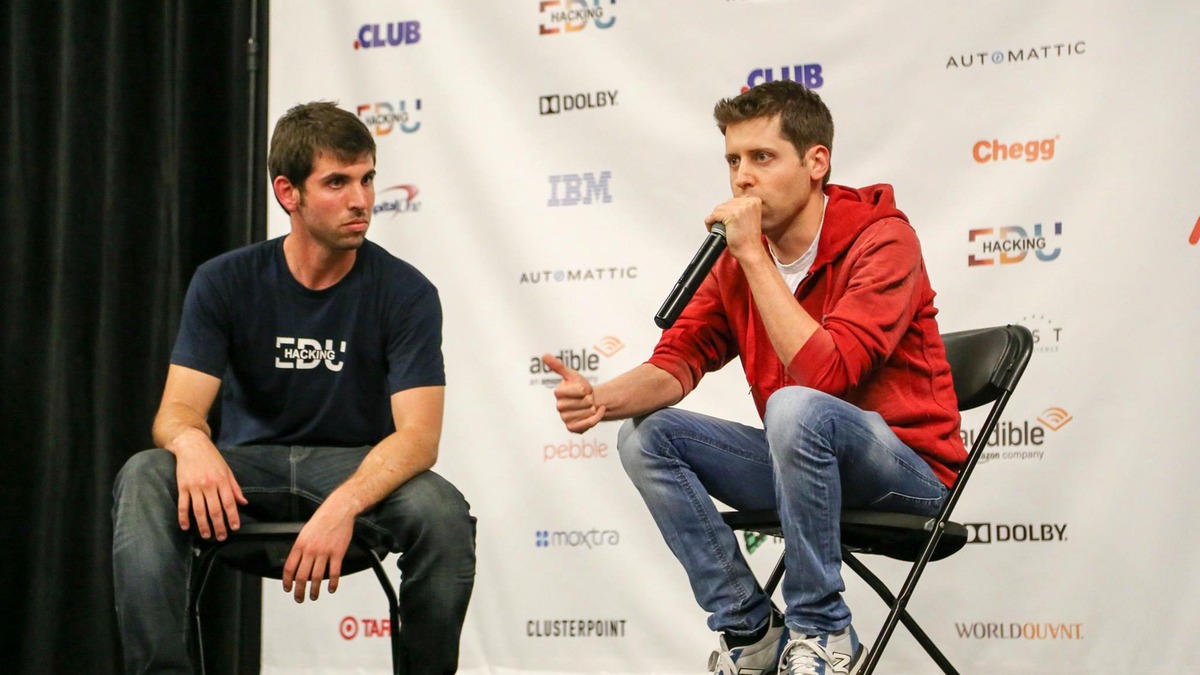 Sam Altman speaking on a panel at a technology conference