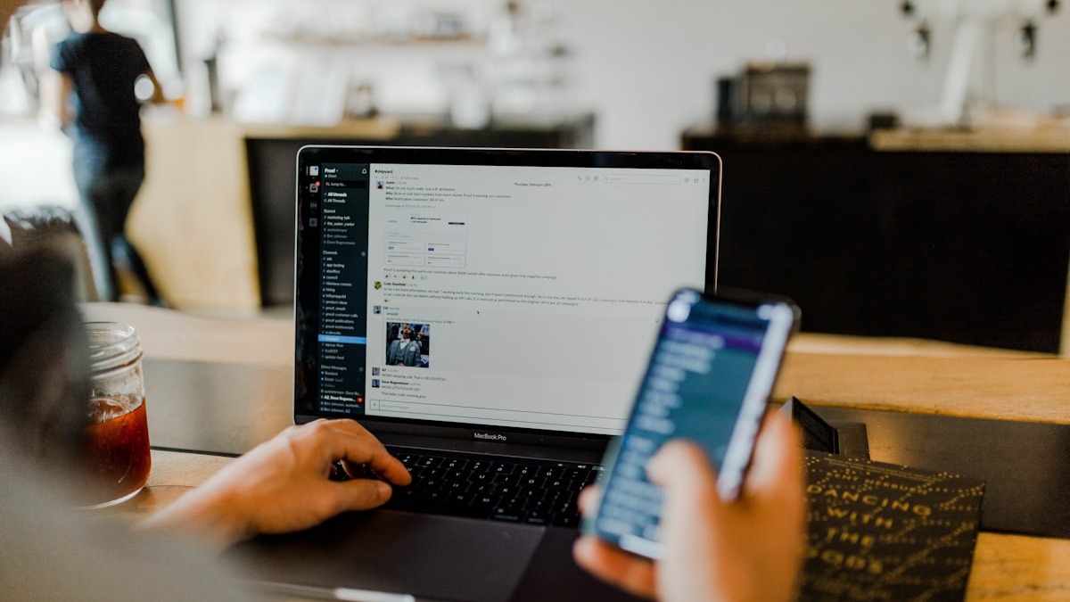 Code being written and reviewed on a monitor, representing AI-assisted security workflows