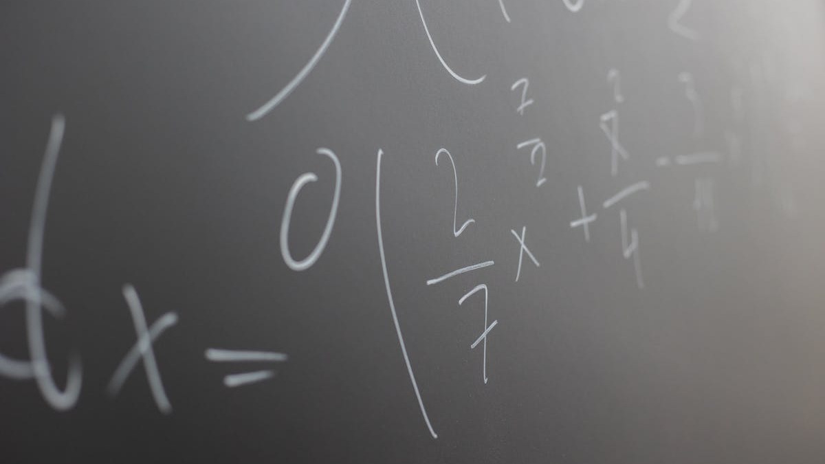 Blackboard with written equations for math lesson