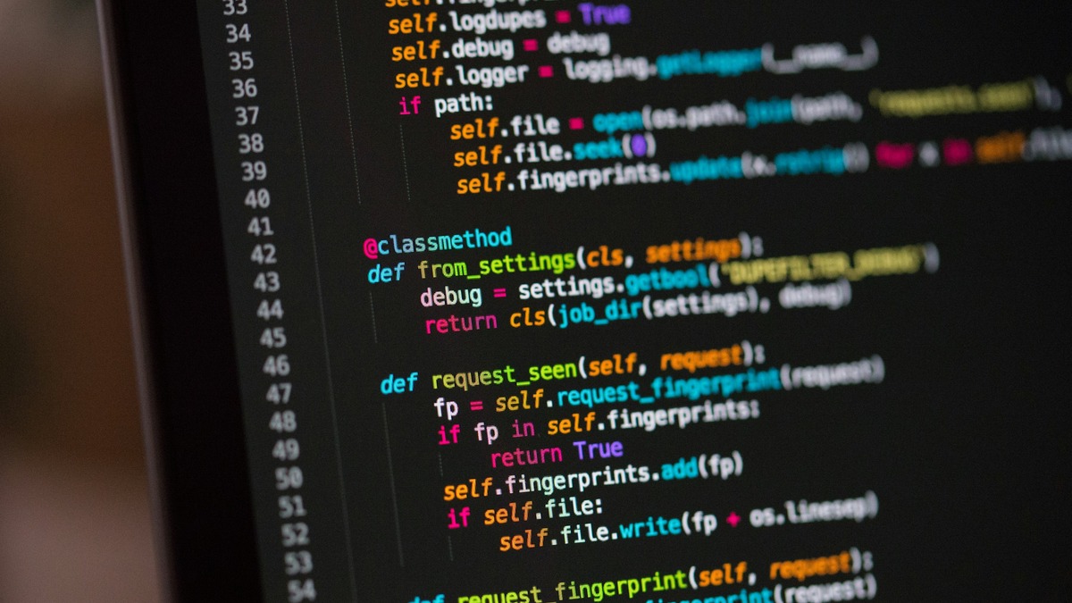 A dark computer screen filled with lines of source code