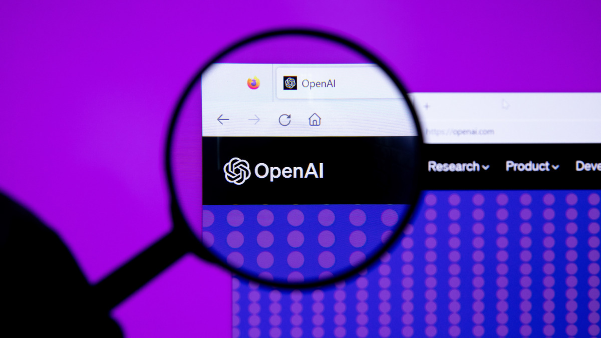 OpenAI logo seen through a magnifying glass