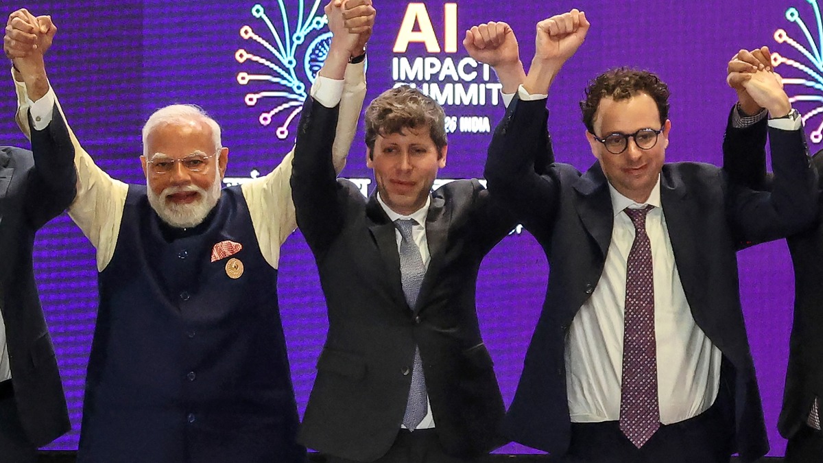 Sam Altman with PM Modi and Dario Amodei at the India AI Impact Summit in February 2026